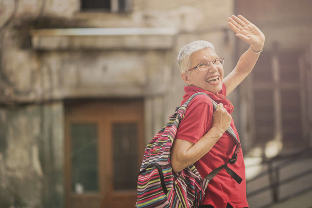 Senior lady traveling abroad, saying goodbye to home and family, Senior lady traveling abroad, saying goodbye to home and family,