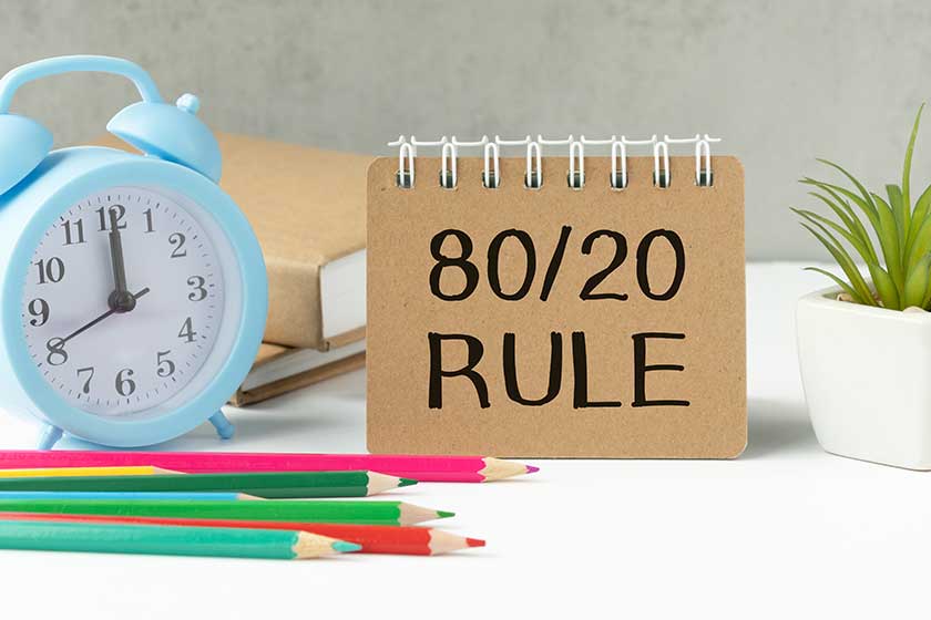 The 80 20 rule text on white paper on a table