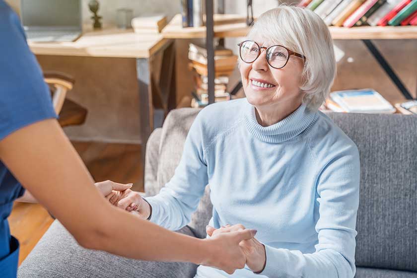 Cropped image of female professional caregiver taking Cropped image of female professional caregiver taking