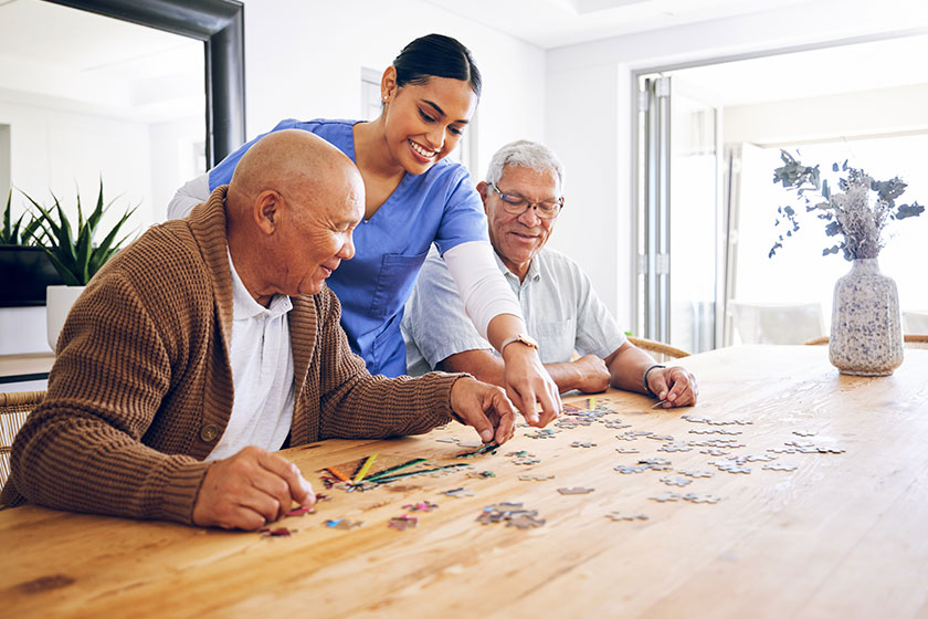 Puzzle, caregiver and senior men playing a game