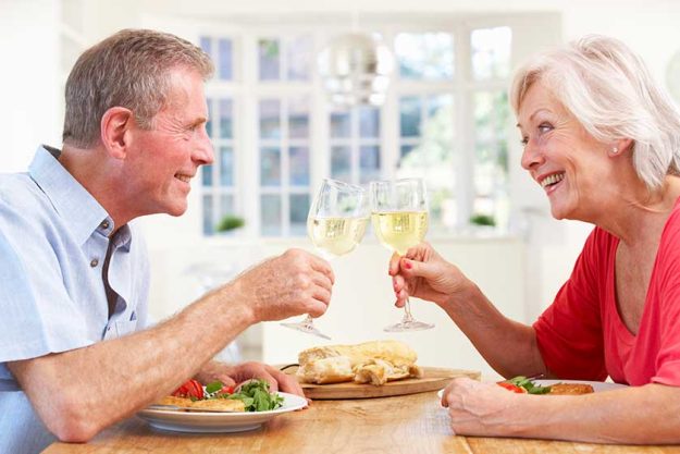 Retired couple enjoying meal Retired couple enjoying meal