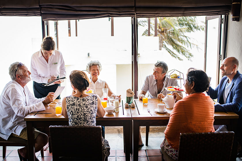 Friends having breakfast at a hotel
