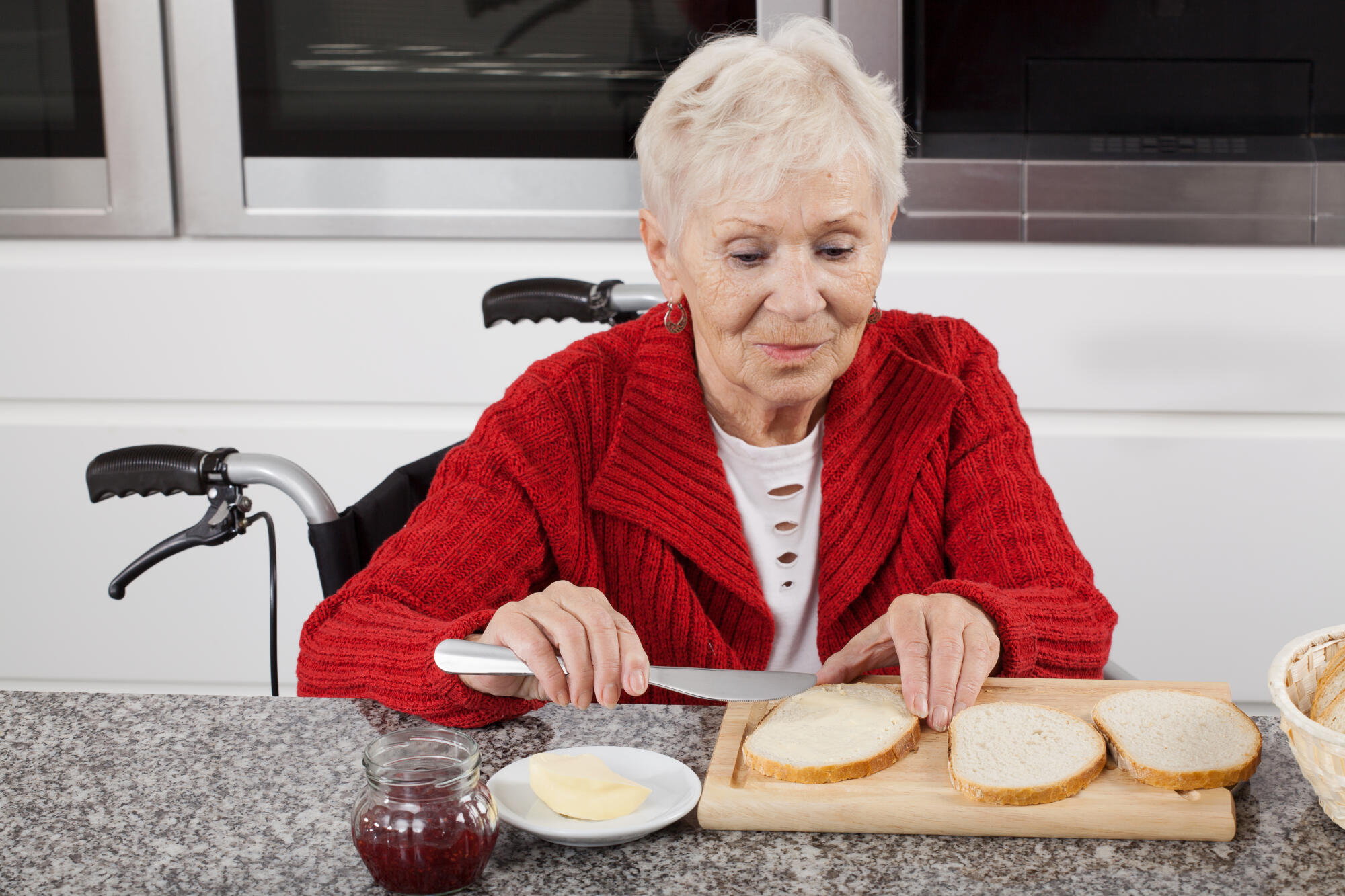 Disabled,Older,Woman,Preparing,Sandwiches,For,Breakfast
