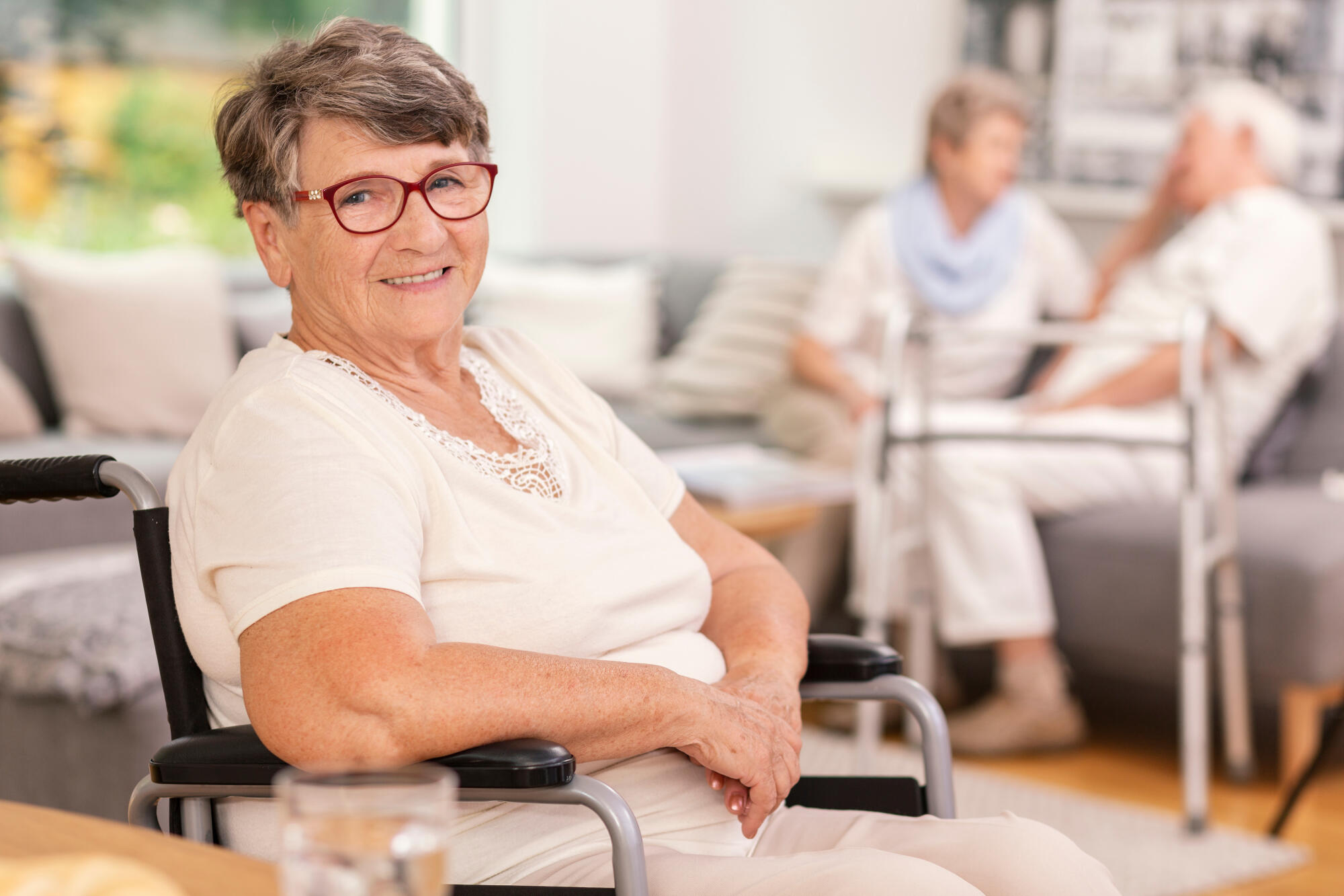 A,Portrait,Of,A,Smiling,Elderly,Woman,In,A,Wheelchair