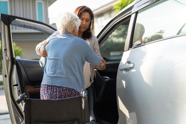 Asian senior or elderly old lady woman patient sitting on wheelc